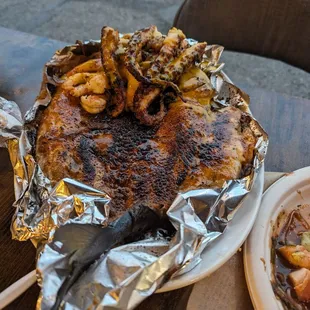 Whole grilled fish (hamachi), comes with some octopus and shrimp too