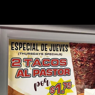 two tacoss and a slice of cheese