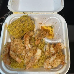 Shrimp over rice with corn