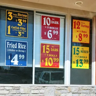 a variety of signs in a store window