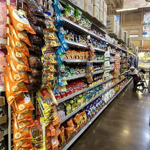 What a great worker - look how organized the snack aisle is!