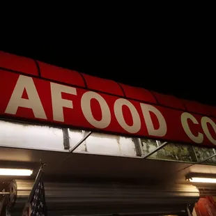 a sign for a seafood corner