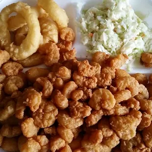 Popcorn shrimp, hush puppies, onion rings, and Coleslaw.