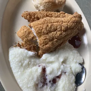 a plate of food with mashed potatoes and a biscuit