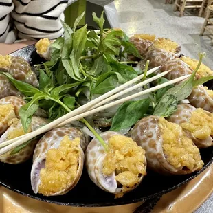 a plate of food with chopsticks