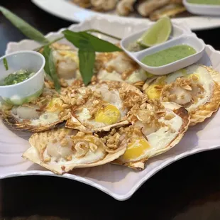 Grilled scallops with quail eggs