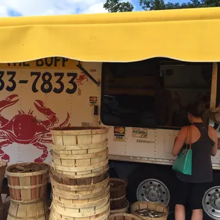 a woman ordering food from a food truck