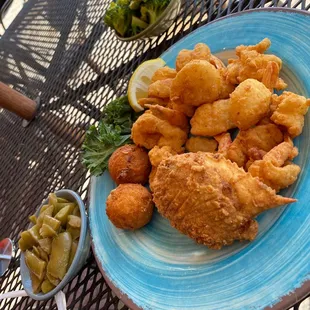 Fried shrimp, fried scallops, fried stuffed crab, green beans, broccoli and hush puppies.