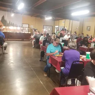 a large group of people sitting at tables