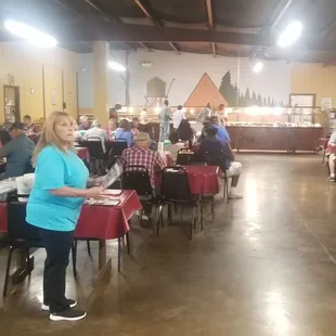 a large group of people sitting at tables