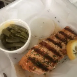Grilled salmon with a side of green beans.