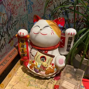 a statue of a lucky cat