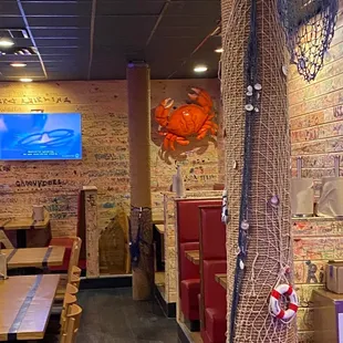 tables, booths, and a flat screen tv