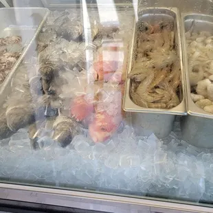 a variety of seafoods on ice