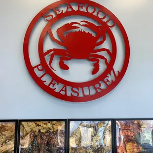 a red sign with a crab on it