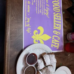 Beignet with raspberry and chocolate sauce