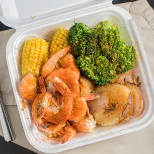 a meal in a styrofoam container