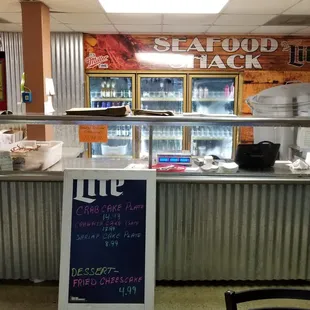 a restaurant counter with a menu on it