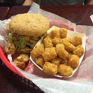 Grilled shrimp poboy on a bun and tater tots. Yum!