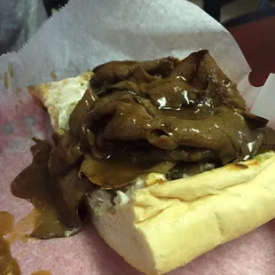 Half of an 8'' roast beef po boy with plenty of gravy