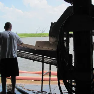 Sortin' Shrimp by Size then,  Sending the Shrimp Up the Conveyor Belt into different Icey Tubs.