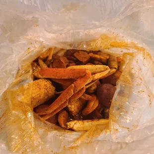 Snowcrab and shrimp (Headless) boil with tango tango seasoning, fire spicy level. The sauce needs a ton more garlic.