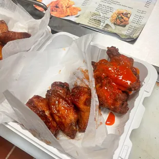 two trays of food on a table