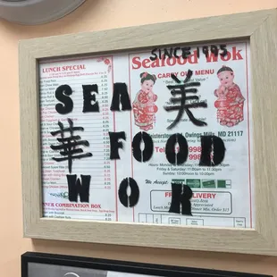 a menu and a clock on the wall