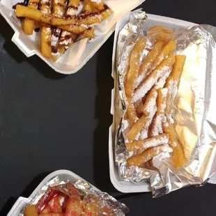 three takeout containers of food