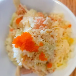 a bowl of rice and carrots