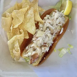 Crab Roll - Dungeness crab meat w/ lemon garlic butter on a brioche roll &amp; lettuce &amp; pineapple coleslaw &amp; wonton chips $26