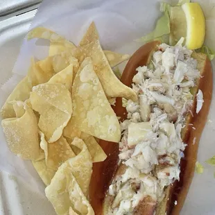 Crab Roll - Dungeness crab meat w/ lemon garlic butter on a brioche roll &amp; lettuce &amp; pineapple coleslaw &amp; wonton chips $26