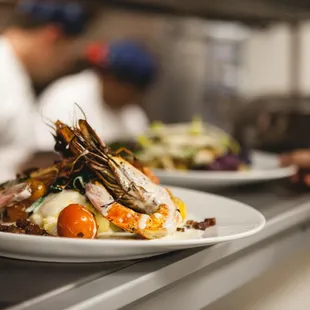 two plates of food on a counter