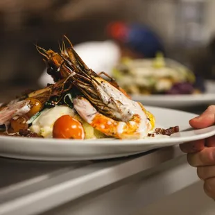 a person holding a plate of food