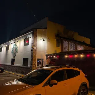 a car parked in front of a building