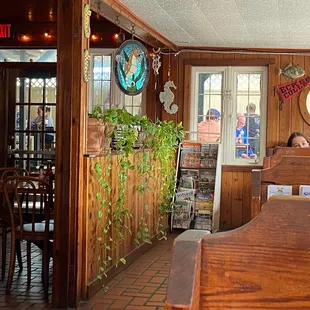 people sitting at tables in a restaurant