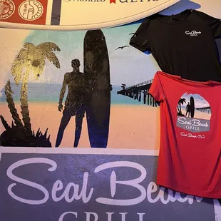 a surfboard, a surfboard, and a t - shirt