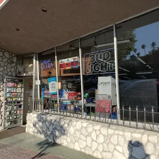 Front of the liquor store next to the Hang Out restaurant.