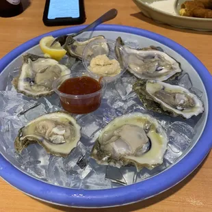 Oyster on half shell!! First time eating them and they weee great with cocktail and Tabasco sauce