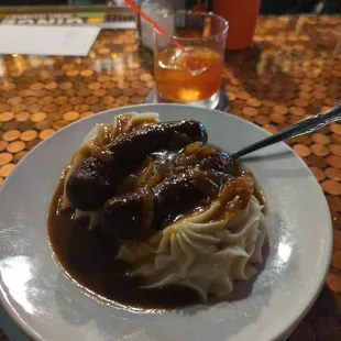 Banger and mash with an Old Fashioned