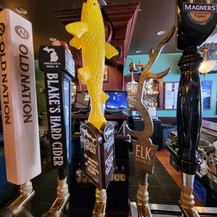 a row of beer taps