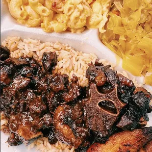 oxtail plate + cabbage + rice + mac and cheese.