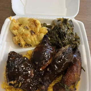 Jerk Chicken over rice, sweet plantains and 2 sides and drink