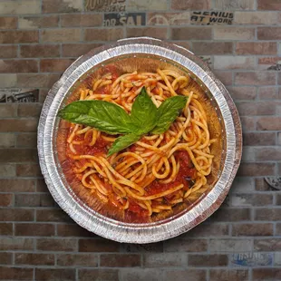 spaghetti with tomato sauce and basil