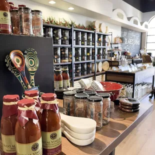 a table with jars of sauces and condiments