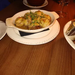 two plates of food on a wooden table