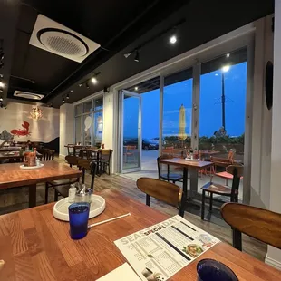 a dining room with a view of the ocean