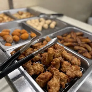 a variety of food items in a buffet