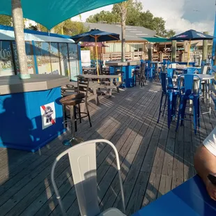 a man sitting at an outdoor bar