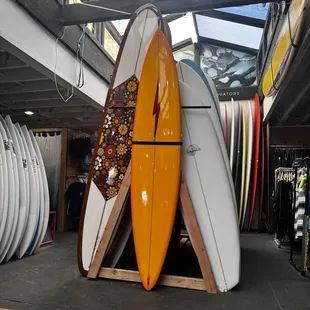 surfboards stacked on top of each other